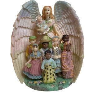 Young's Inc. vintage angel figurine depicting an angel w/"children of the world